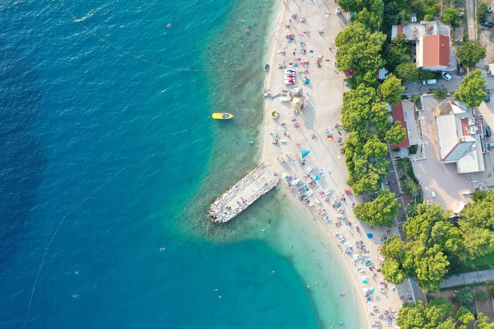 shore-with-building-st-daytime-makarska-croatia-min-2048x1365